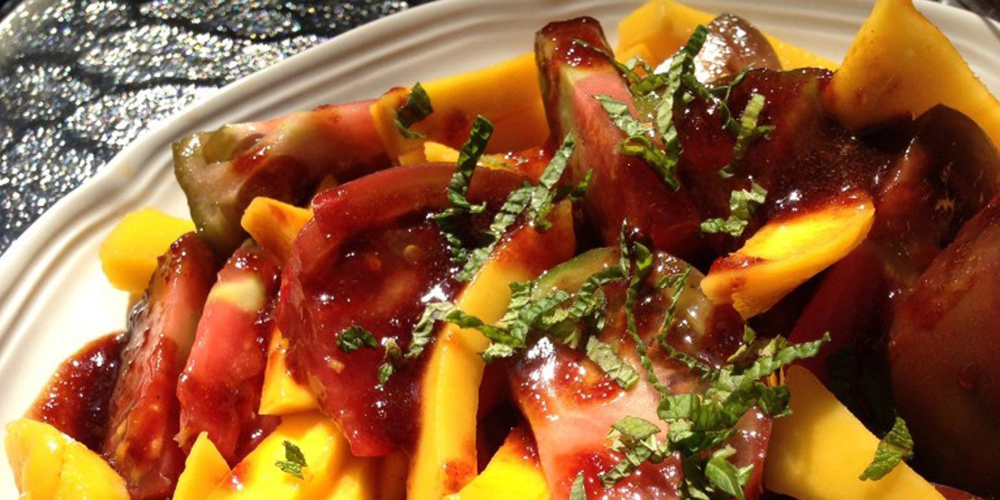 Tomato Mango Salad with Curry Elderberry Orange Vinaigrette