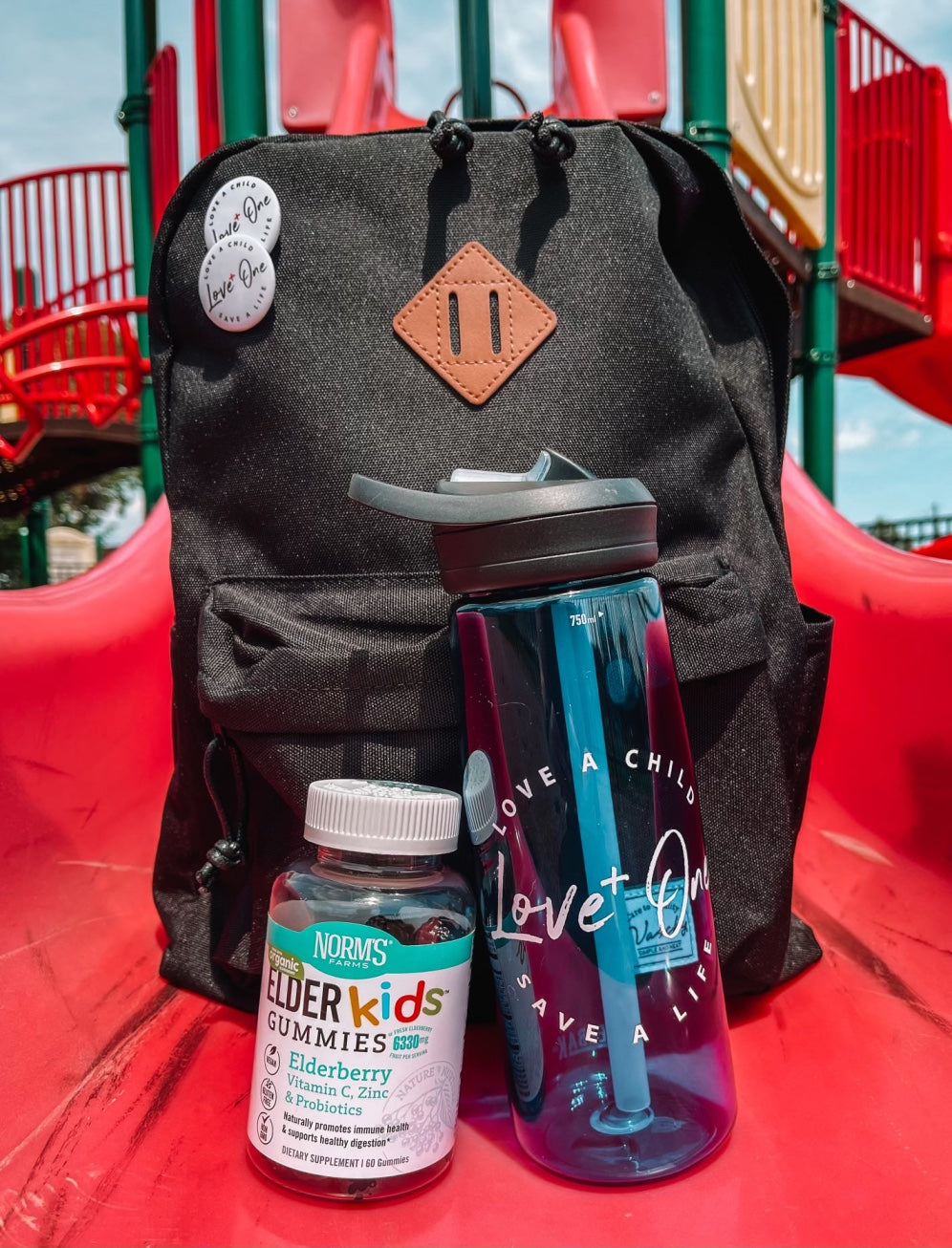 Backpack on the playground with Elderberry Gummies!
