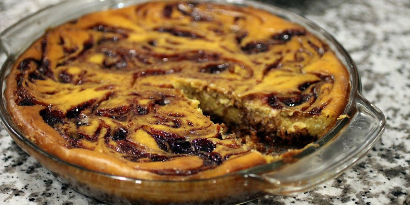 Pumpkin and Elderberry Marbled Cheesecake with Candied Pecan Crust